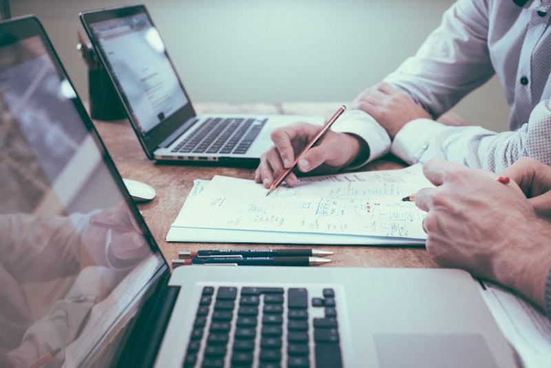 Payroll specialists reviewing statutory submissions